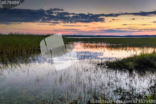 Image of Colorful sunset over lake in Latvia