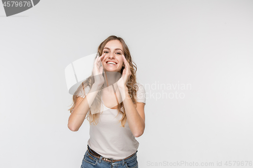 Image of Isolated on pink young casual woman shouting at studio