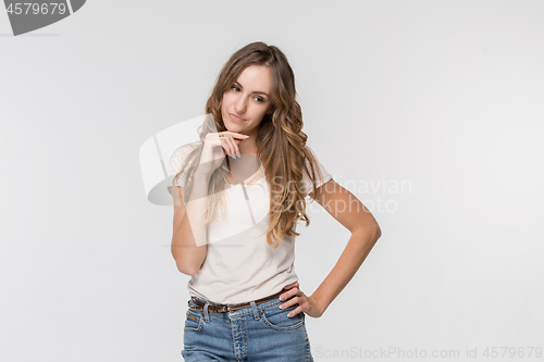 Image of Young serious thoughtful business woman. Doubt concept.