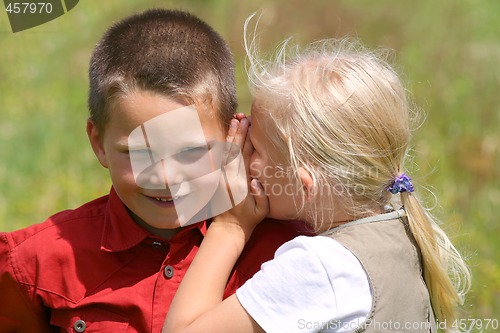 Image of Whispering and smiling