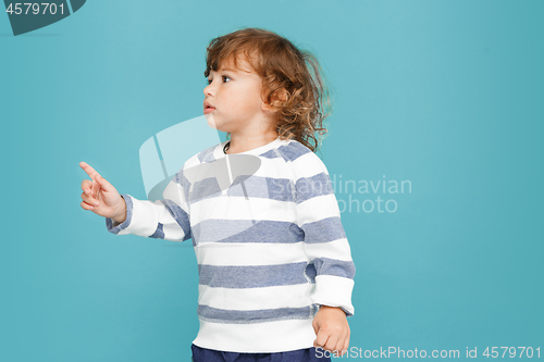 Image of Portrait of happy joyful beautiful little boy, studio shot