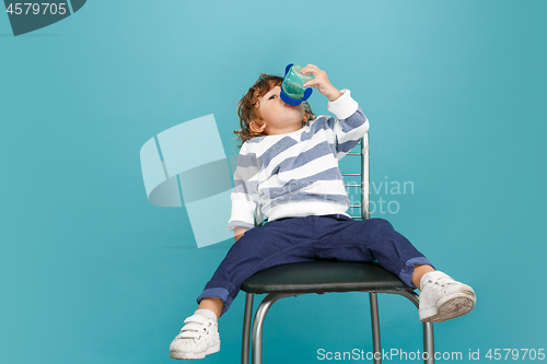 Image of Portrait of happy joyful beautiful little boy, studio shot