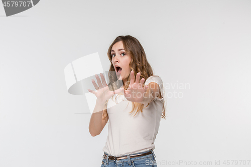 Image of Portrait of the scared woman on white