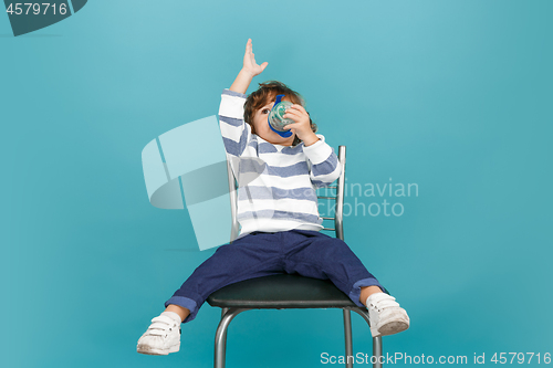 Image of Portrait of happy joyful beautiful little boy, studio shot