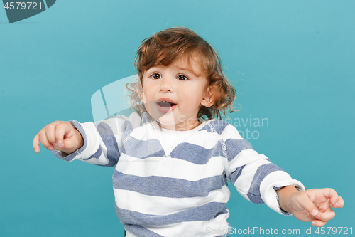 Image of Portrait of happy joyful beautiful little boy, studio shot