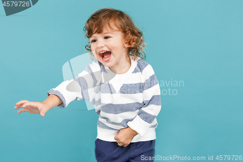 Image of Portrait of happy joyful beautiful little boy, studio shot