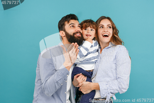 Image of A happy family on blue background