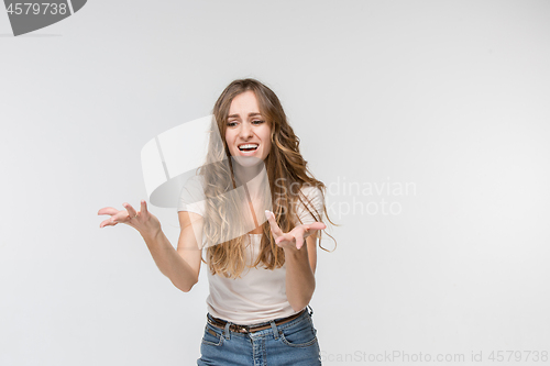 Image of Beautiful woman looking suprised and bewildered isolated on white