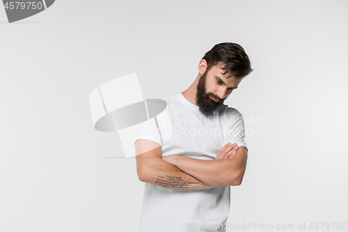Image of Beautiful sad man at studio