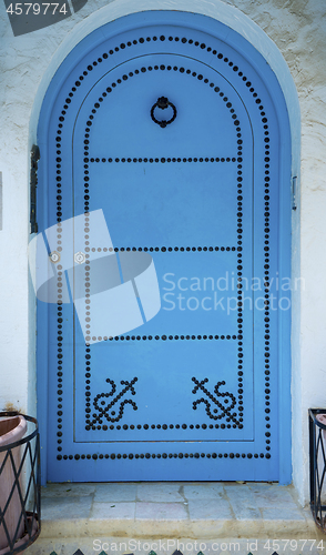 Image of Aged Blue door in Andalusian style from Sidi Bou Said