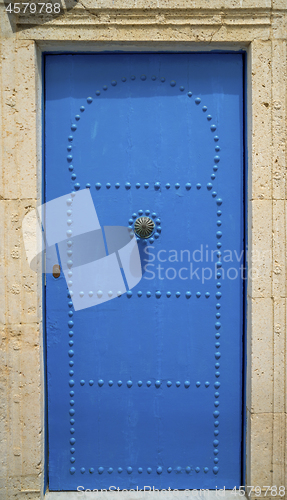 Image of Aged Blue door in Andalusian style from Sidi Bou Said