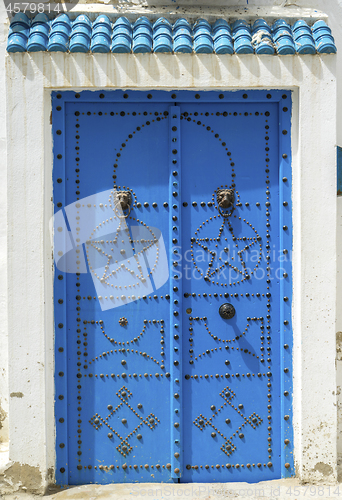 Image of Aged Blue door in Andalusian style from Sidi Bou Said