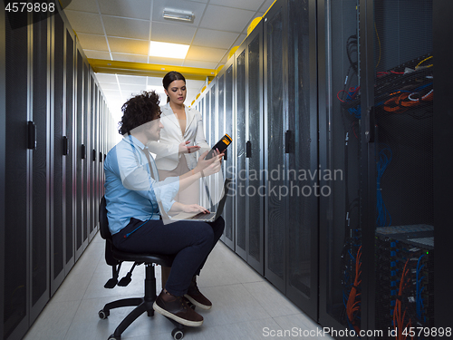 Image of technicians working together on servers