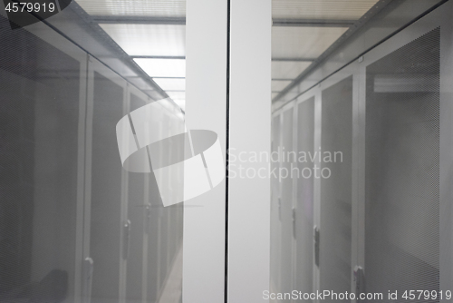 Image of modern server room with white servers