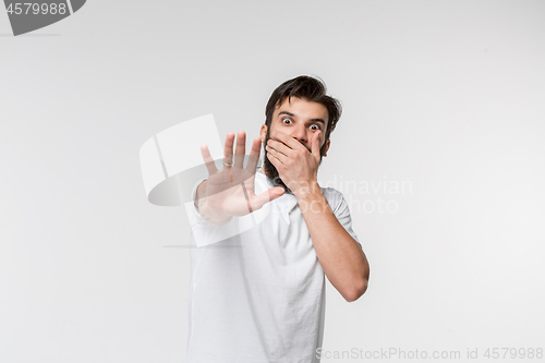 Image of Portrait of the scared man on white