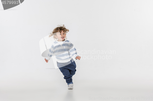 Image of Portrait of happy joyful beautiful little boy, studio shot