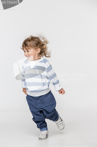 Image of Portrait of happy joyful beautiful little boy, studio shot