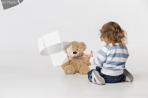 Image of Portrait of happy joyful beautiful little boy, studio shot