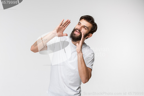 Image of Isolated on pink young casual man shouting at studio