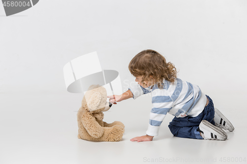 Image of Portrait of happy joyful beautiful little boy, studio shot