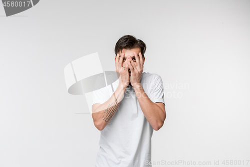 Image of Portrait of the scared man on white