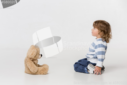 Image of Portrait of happy joyful beautiful little boy, studio shot