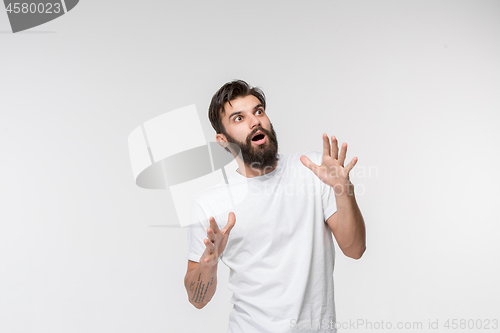 Image of Portrait of the scared man on white