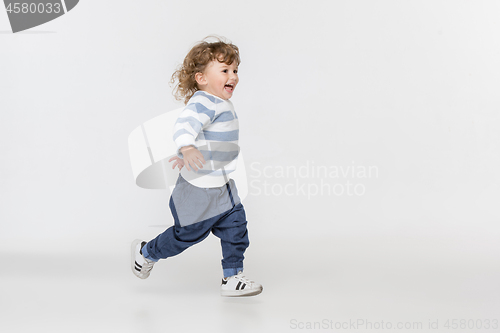 Image of Portrait of happy joyful beautiful little boy, studio shot