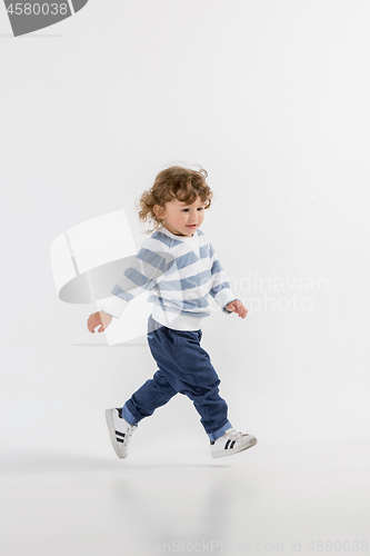 Image of Portrait of happy joyful beautiful little boy, studio shot