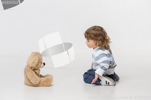 Image of Portrait of happy joyful beautiful little boy, studio shot