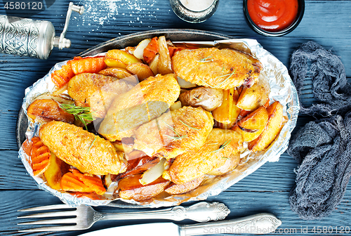 Image of potato with chicken wings