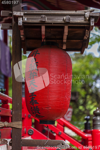 Image of Traditional japanese red paper lantern near temple