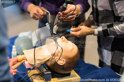 Image of Medical doctor specialist expert displaying method of patient intubation technique on hands on medical education training and workshop