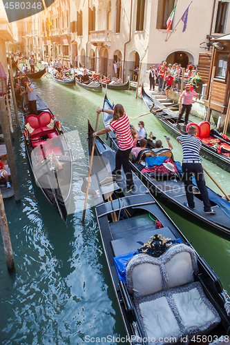 Image of Gondolas with gondoliers in Venice