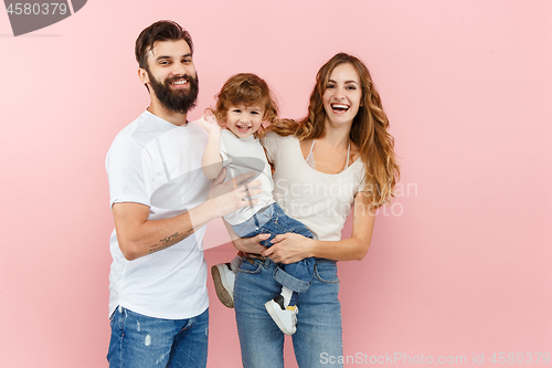 Image of A happy family on pink background