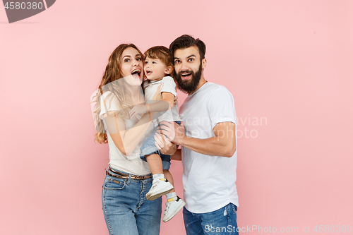 Image of A happy family on pink background