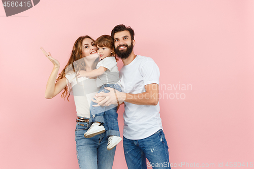 Image of A happy family on pink background