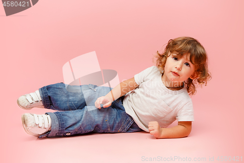 Image of Portrait of happy joyful beautiful little boy, studio shot