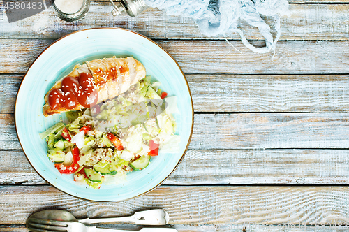 Image of fried chicken breast and salad