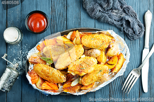 Image of potato with chicken wings