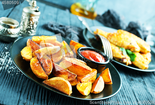 Image of potato with chicken wings