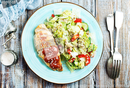 Image of fried chicken breast and salad