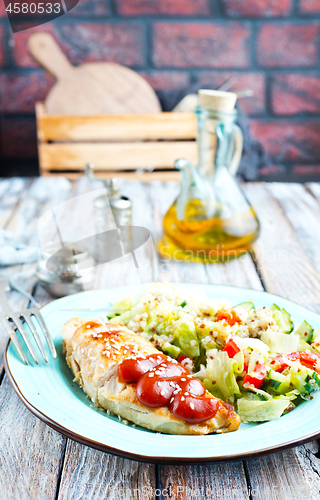 Image of fried chicken breast and salad