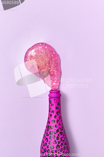 Image of Open painted spots hot pink bottle with paint spot as a wine foam.