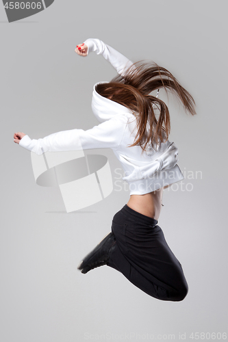 Image of attractive jumping woman