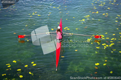 Image of Woman Single sculls rower during the start of a rowing