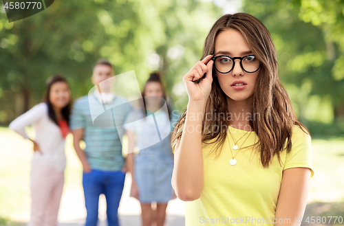 Image of young woman or teenage girl in glasses