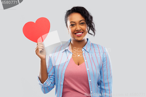 Image of happy african american woman with red heart