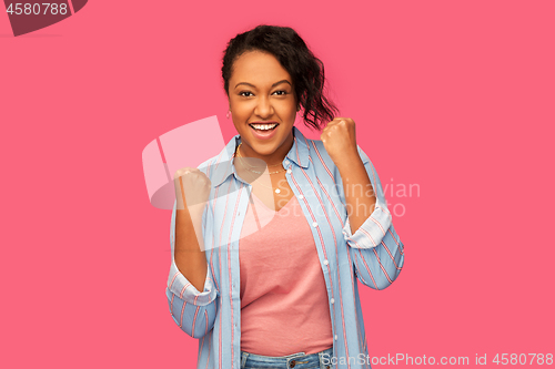 Image of happy african american woman celebrating success