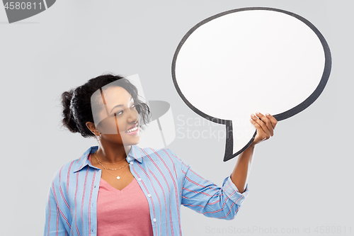Image of happy african american woman holding speech bubble